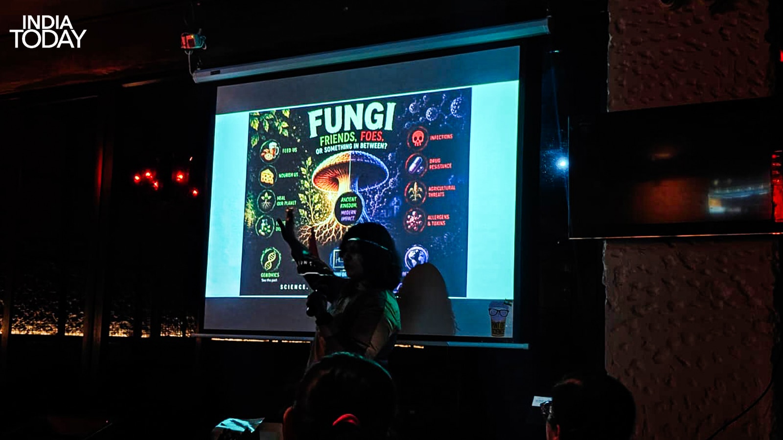 Dr Aakriti Jain presenting the dual nature of fungi at Pint of Science 2026, Delhi. Fungi feed us, heal us and nourish the planet. They also cause infections, drive drug resistance and produce allergens and toxins. The question, she told the room, is not whether to pay attention. It is whether we have been paying enough. (Photo: Radifah Kabir/India Today)