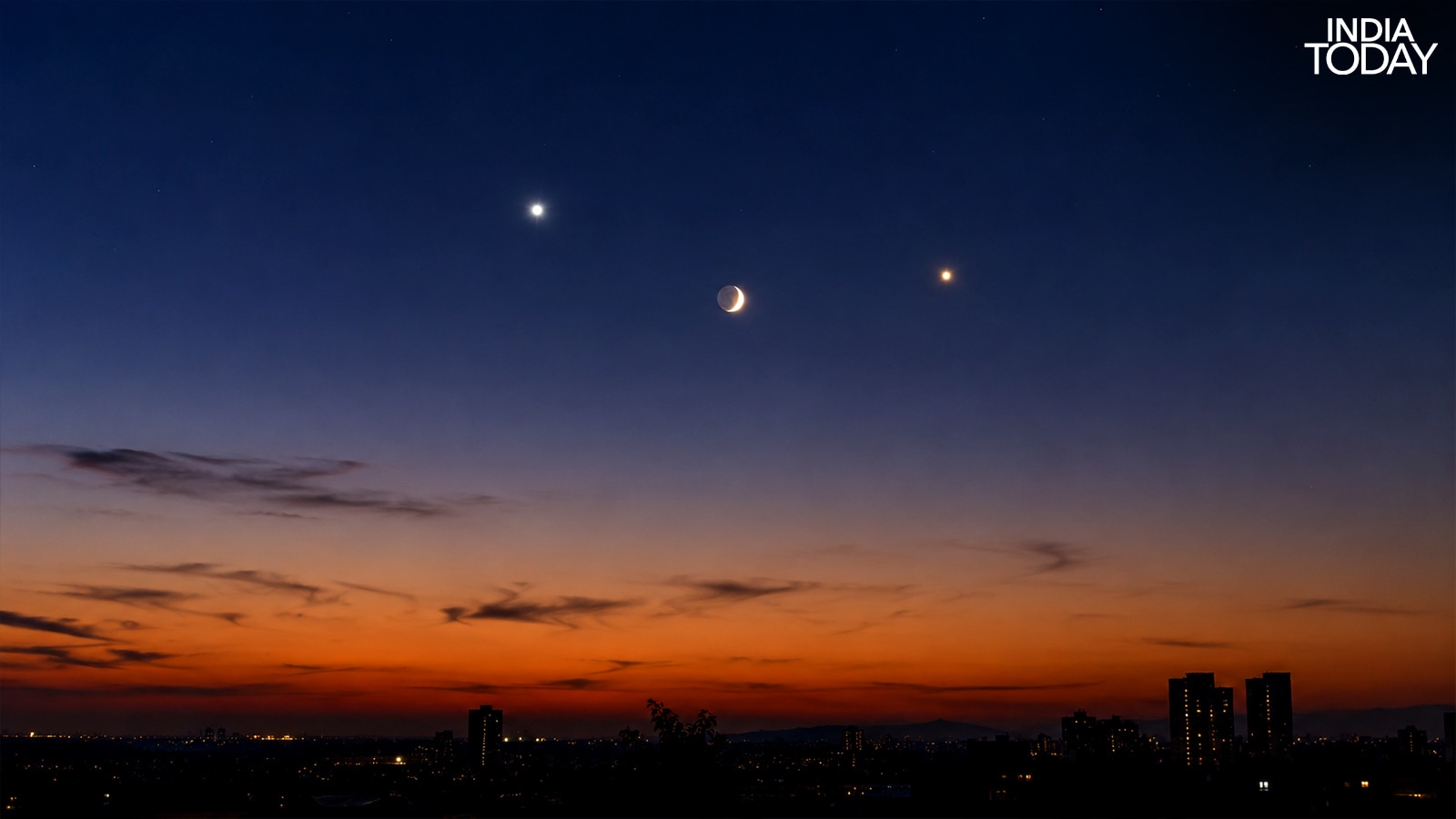 The faint glow on the Moon's dark side is earthshine: sunlight reflected off Earth's clouds and oceans, which bounces back from the lunar surface to human eyes. (Photo: Radifah Kabir)