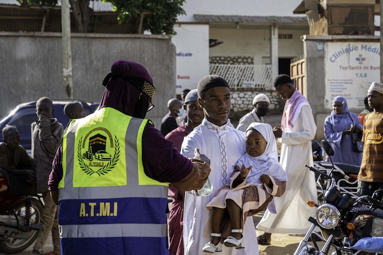 A worshipper has his temperature taken outside a Mosque in Bunia, Congo on the first day of Eid.