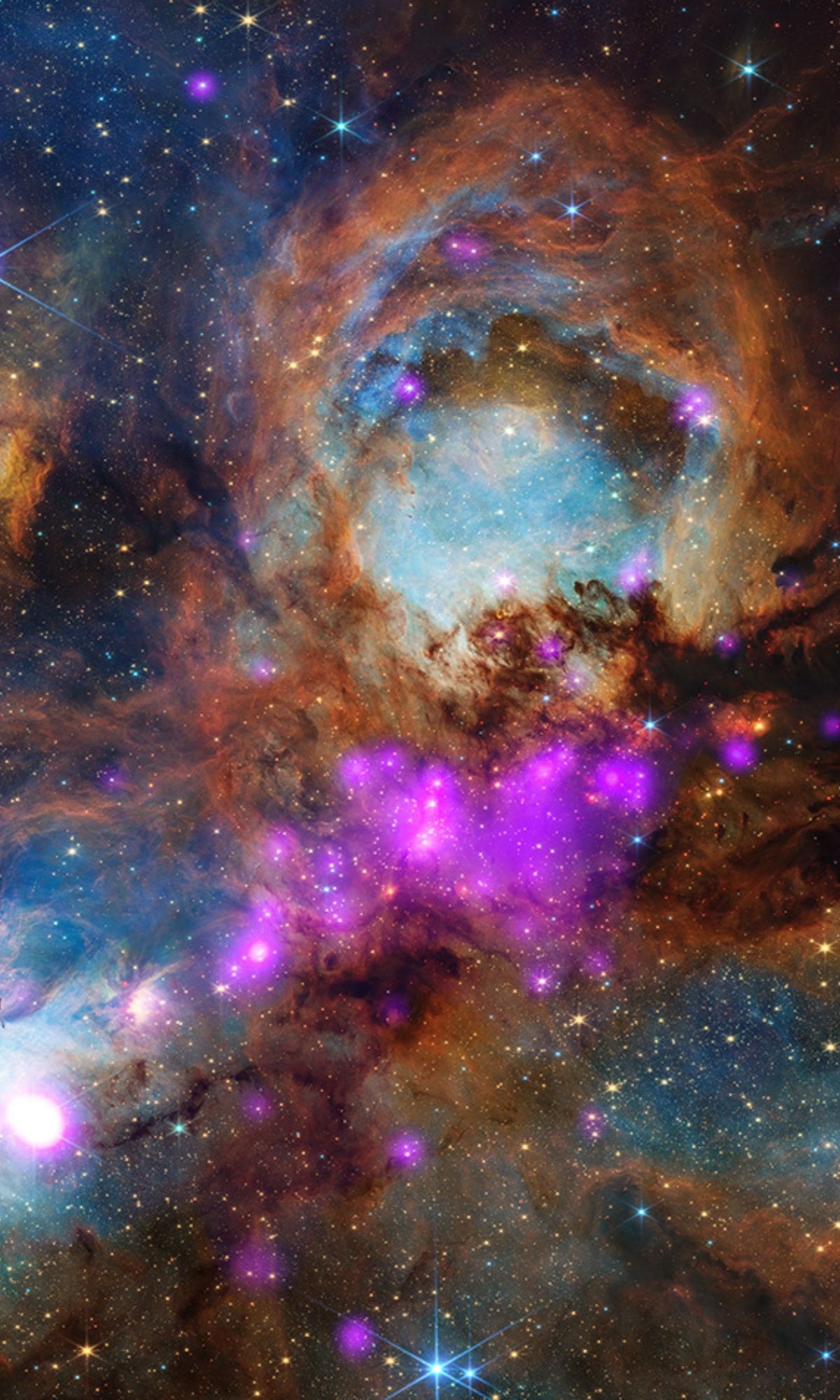 Pink and purple hues from Chandra's X-ray data mark scorching young stars, while Webb's infrared light, shown in blue, orange, and red, maps glowing gas, dust filaments, and active star-forming clumps within the Cat's Paw Nebula. (Photo: Nasa)