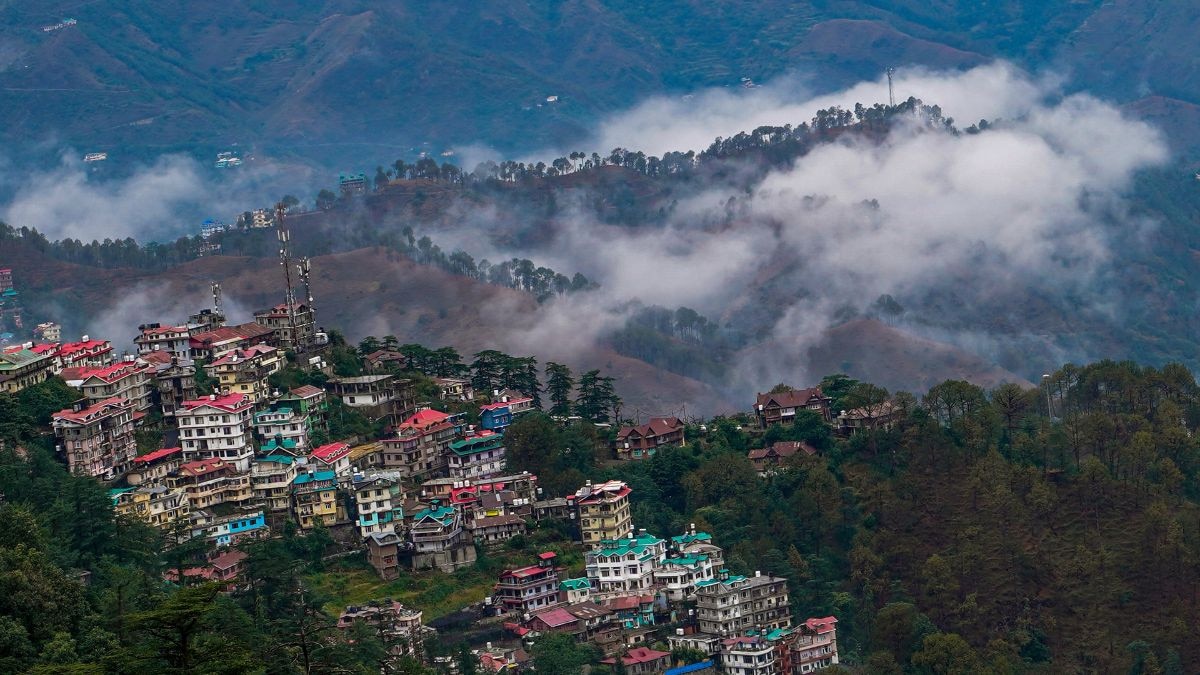 Clouds hover over the hills after rain in Shimla. (Photo: PTI)