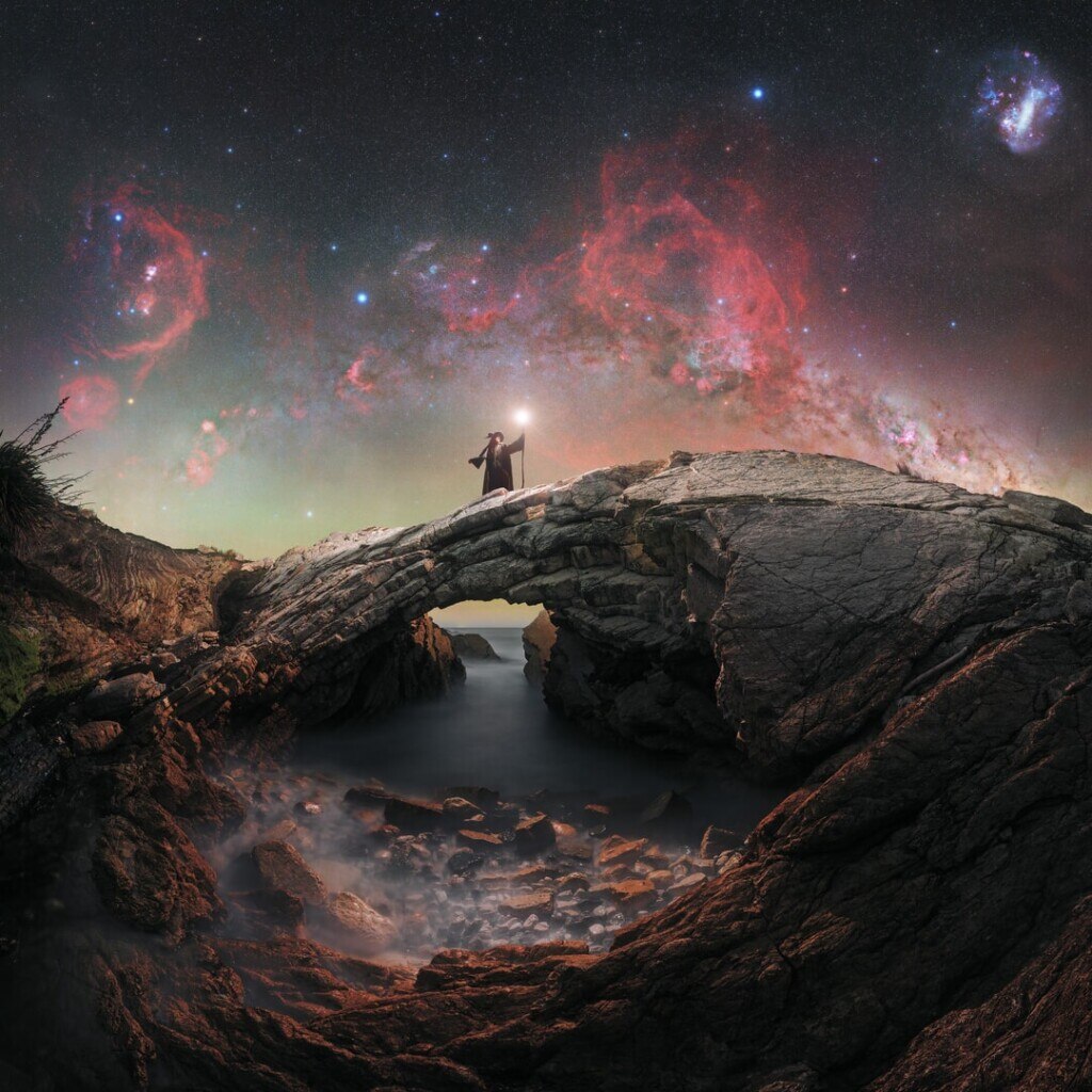 The southern Milky Way rises above the dramatic rock formations of the Wairarapa Coast in New Zealand. A seal, which had refused to leave its favourite resting spot on the rocks, can be spotted in the lower foreground of this panorama by Evan McKay. (Photo credit: Evan McKay/Capture the Atlas)