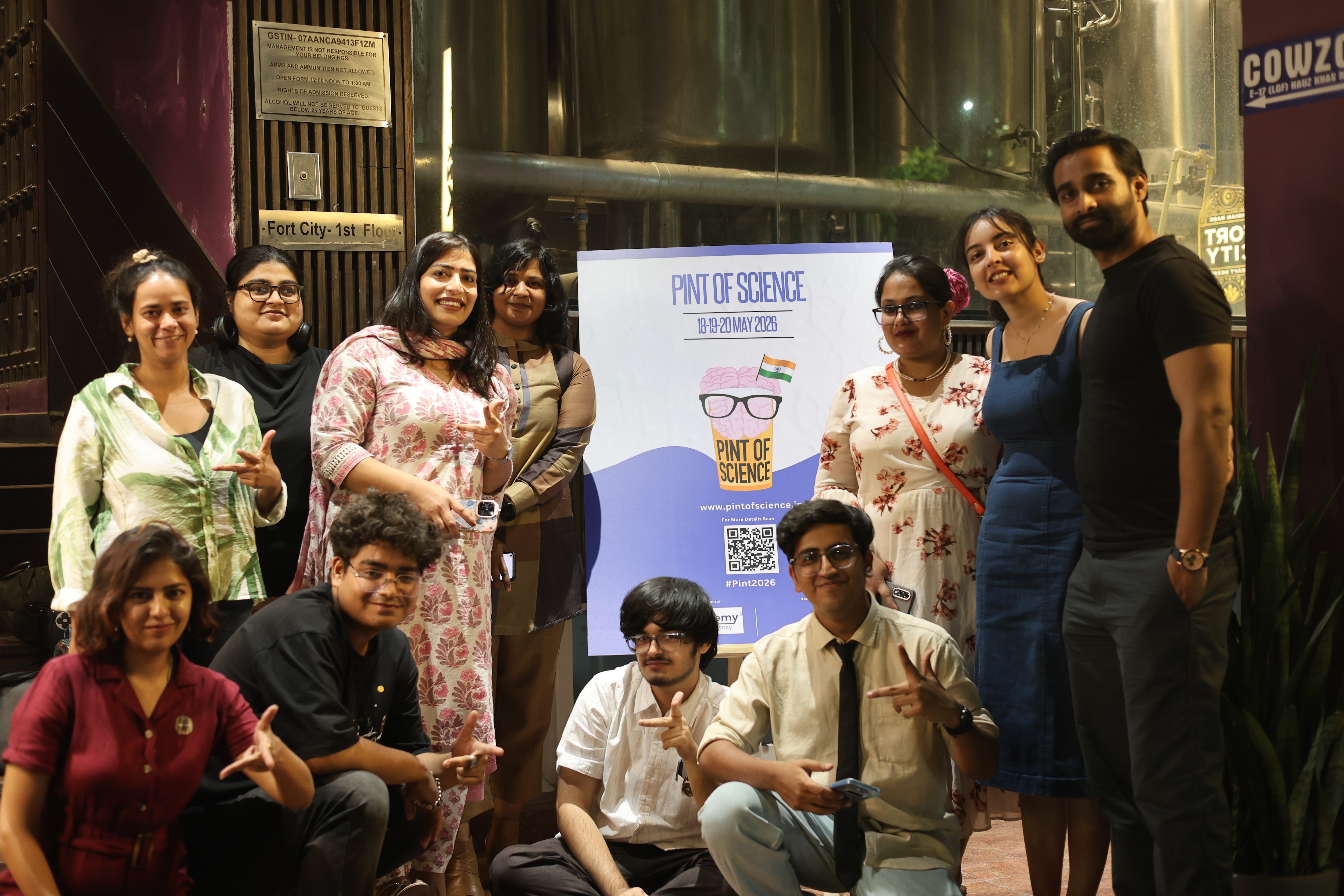 The Pint of Science 2026 team with scientists and journalists outside Fort City Brewing in Hauz Khas, Delhi, where three nights of beer mixed with science played out from May 18 to May 20. (Photo: Radifah Kabir)