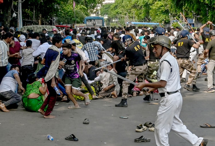 Kolkata police Police personnel launched a lathicharge in Park Circus after a protest against a demolition drive at Tiljala area turned violent. (Image: PTI)