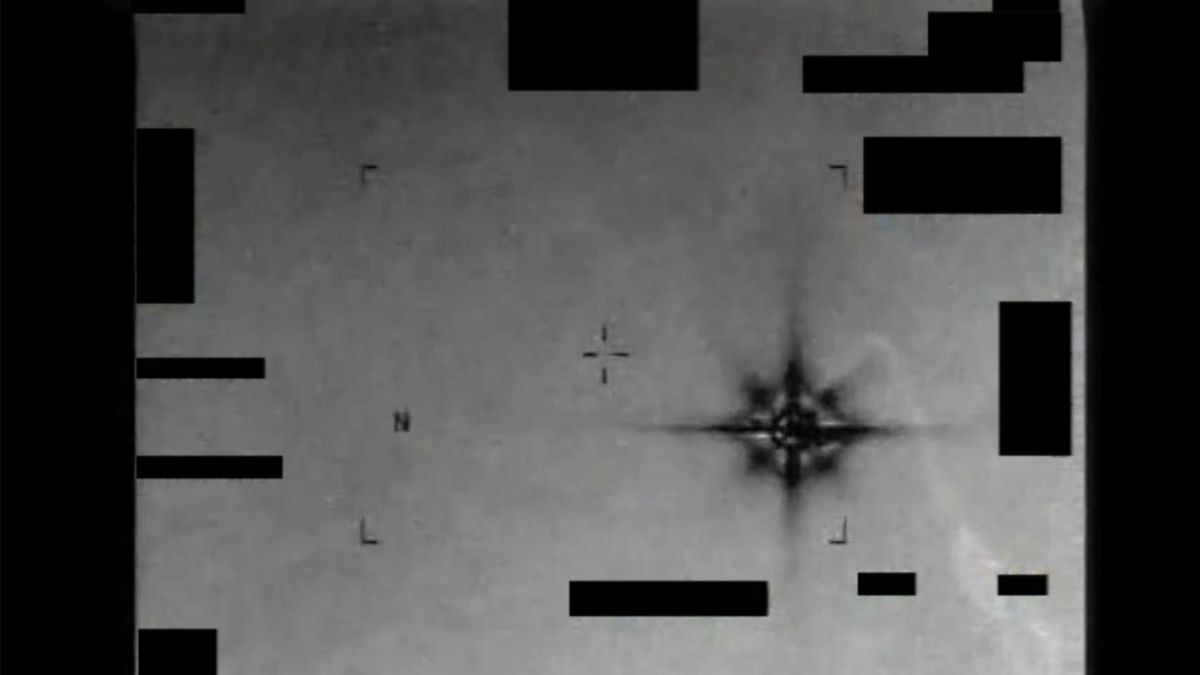 A still from declassified infrared footage, showing a bright, eight-pointed star-shaped object drifting across the frame. The video was captured by a US military sensor over the Middle East in 2013 and remains officially unresolved. (Photo: AARO/Department of War)