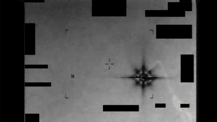 A still from declassified infrared footage, showing a bright, eight-pointed star-shaped object drifting across the frame. The video was captured by a US military sensor over the Middle East in 2013 and remains officially unresolved. (Photo: AARO/Department of War)