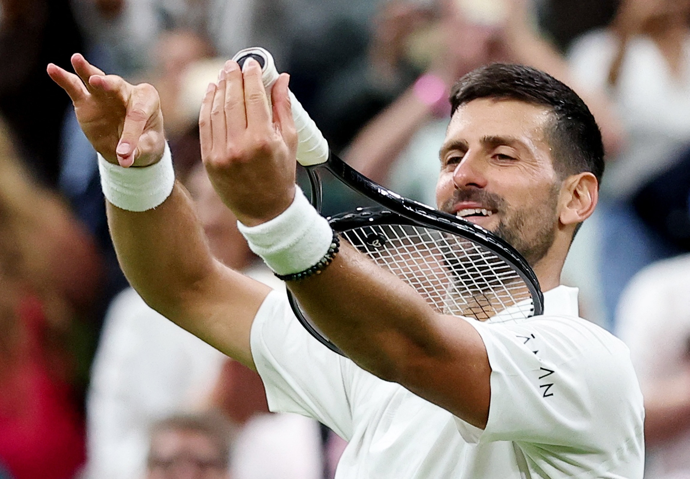 Djokovic celebrates winning the opening round at Wimbledon. (Image: Reuters)