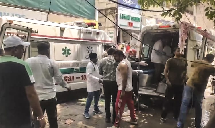 Security and health officials at the site after a fire broke out in a restaurant in south Delhi's Malviya Nagar. (Photo: PTI)