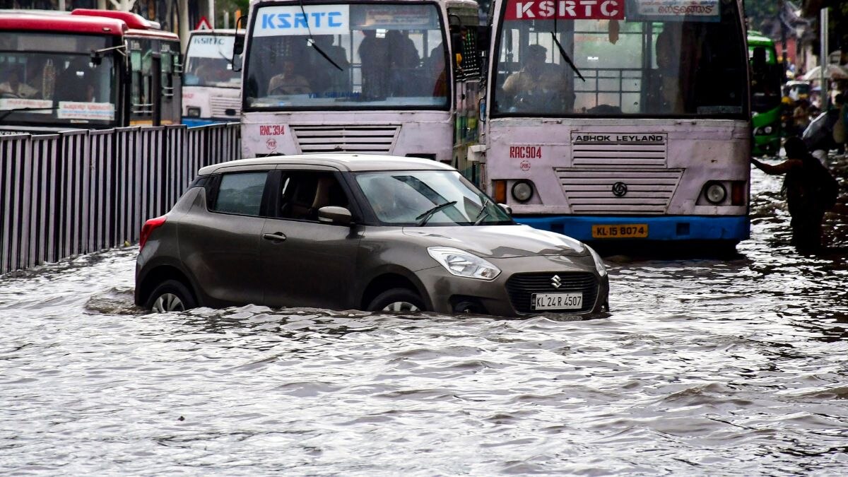 Vehicles navigate a heavily waterlogged street following intense rainfall in Thiruvananthapuram, Kerala, on Saturday, May 30, 2026. (Photo: PTI)