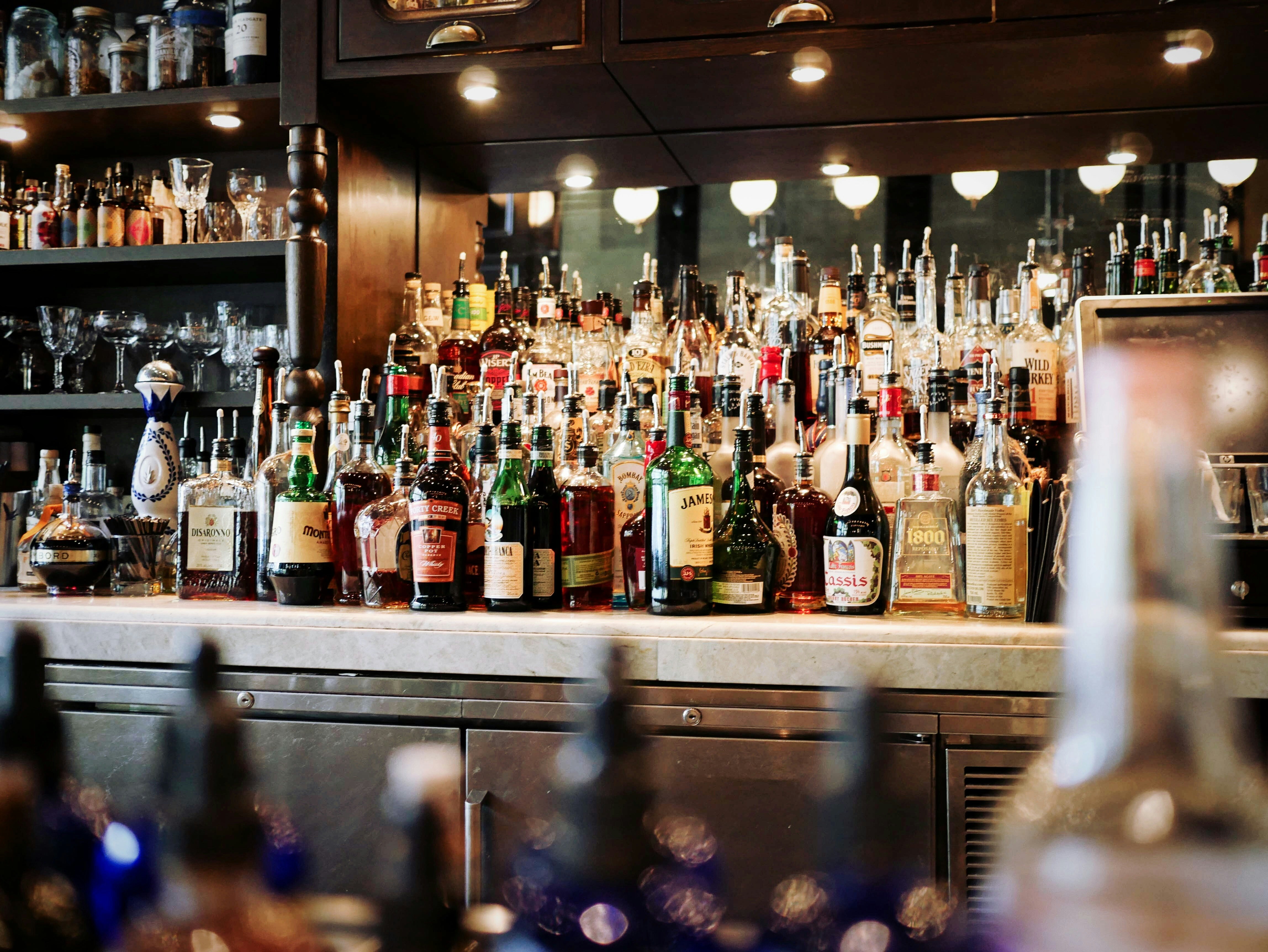 Neutral spirit comes off the still at 96% alcohol by volume, gets diluted to 42.8%, then flavoured into either rum or whisky. (Photo: Unsplash)