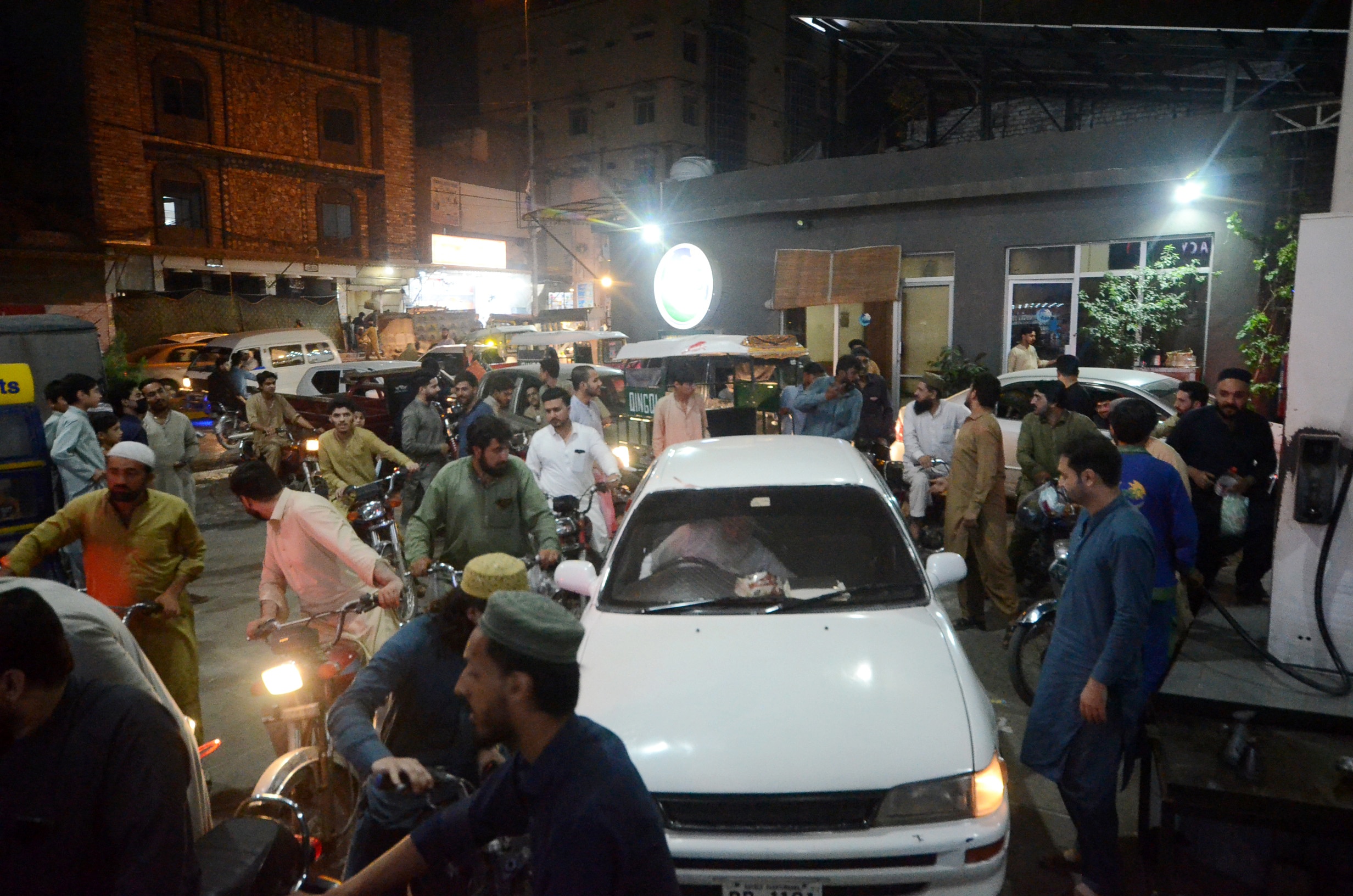 Surging import costs since the start of the US-Iran war have strained Pakistanâs finances. Motorists queue at a petrol pump in Peshawar following a fuel price hike in April. (Image: Getty)  