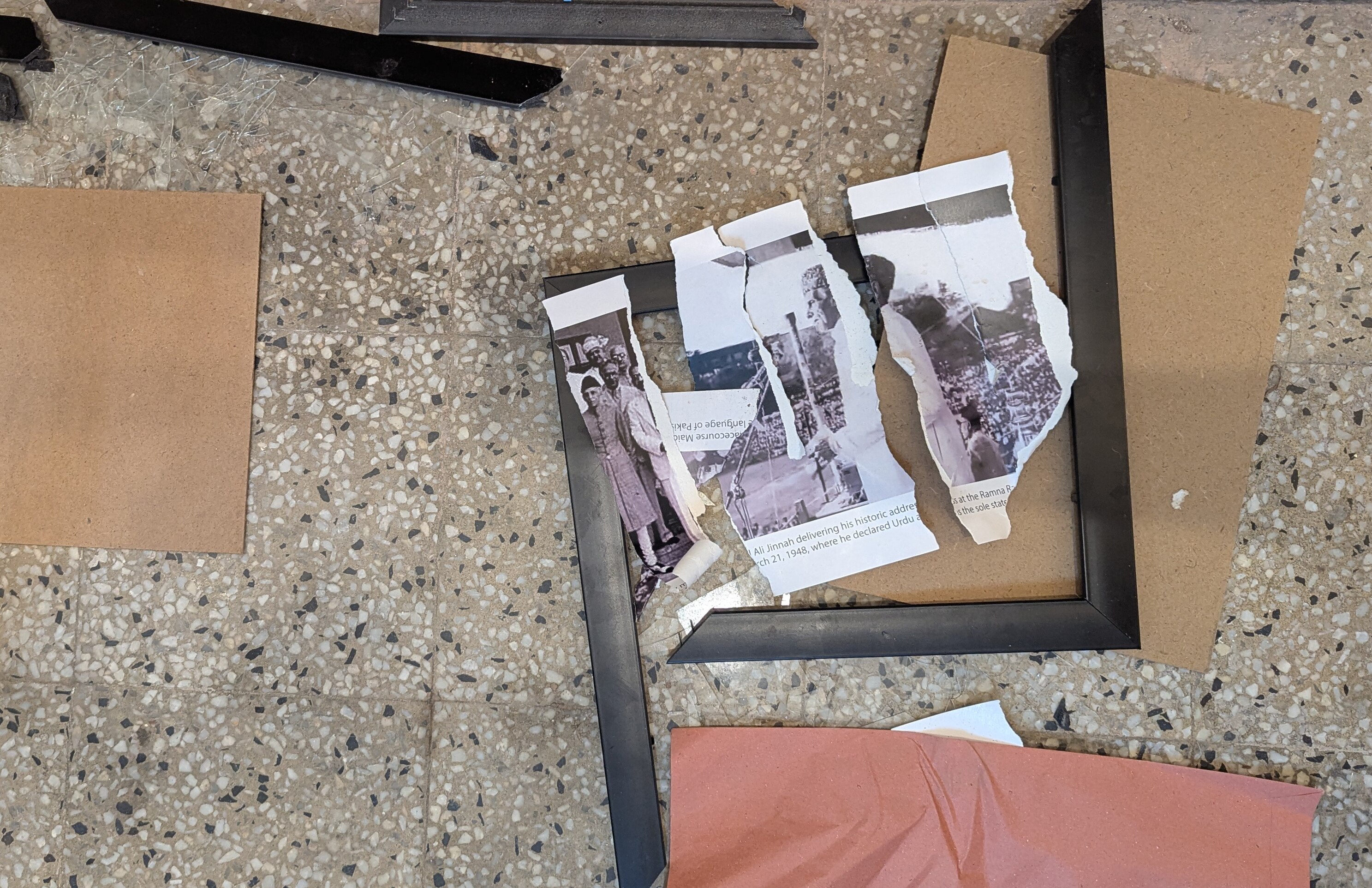 Photos of Muhammad Ali Jinnah at DUCSU Museum were later torn up by a protesting student. (Image: Getty)