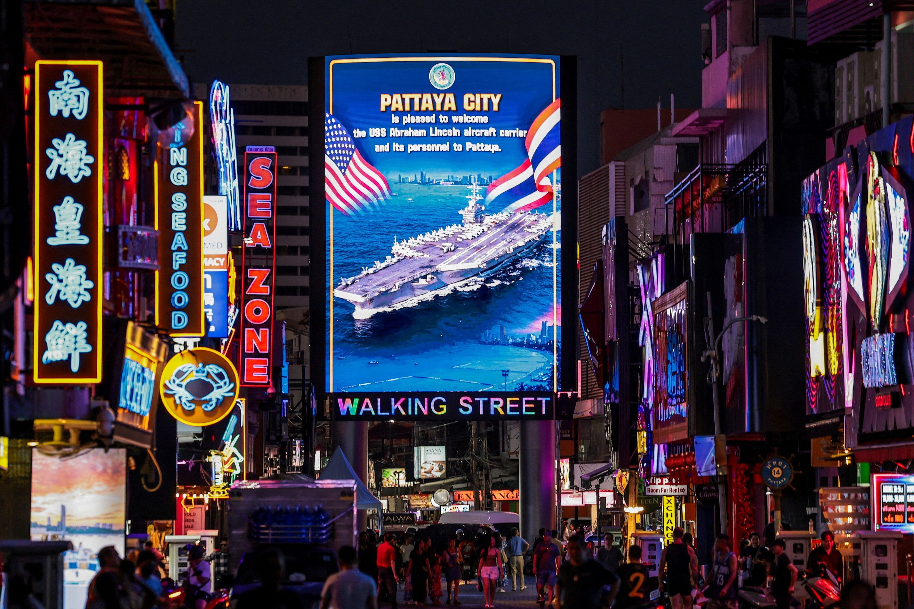 An LED display was set up in Walking Street welcoming USS Abraham Lincoln crew to Pattaya. (Image: Reuters)