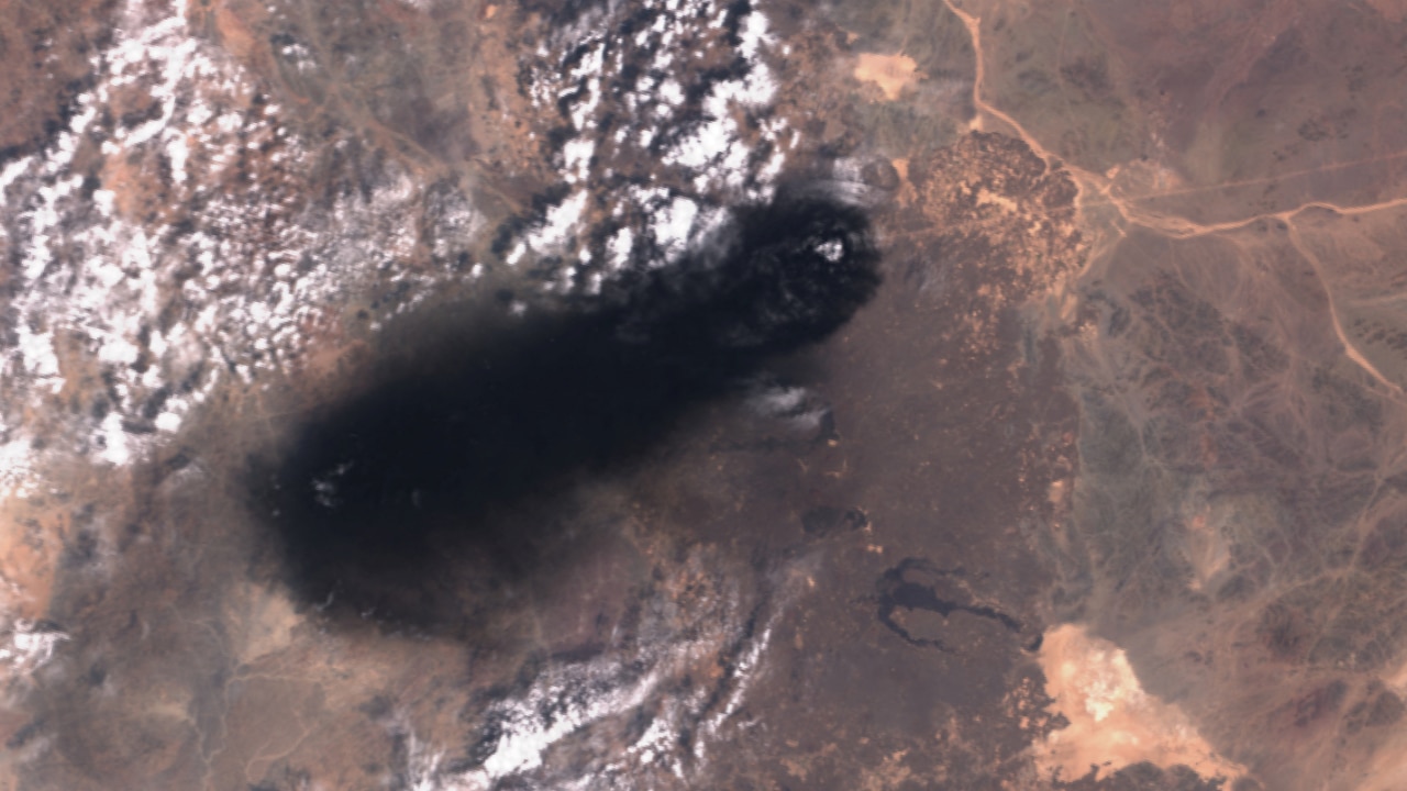 A satellite image shows black smoke rising from an area of Saudi Arabiaâs East-West oil pipeline south of Medina