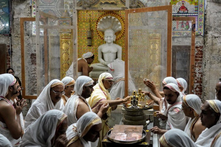 Devotees from Jain Community offer their prayers on the occasion of