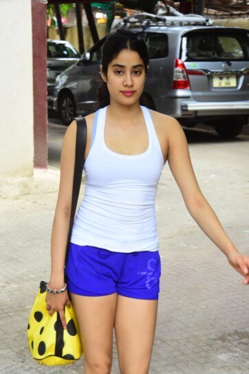 Janhvi Kapoor keeps it simple in ganji and mini shorts at ...