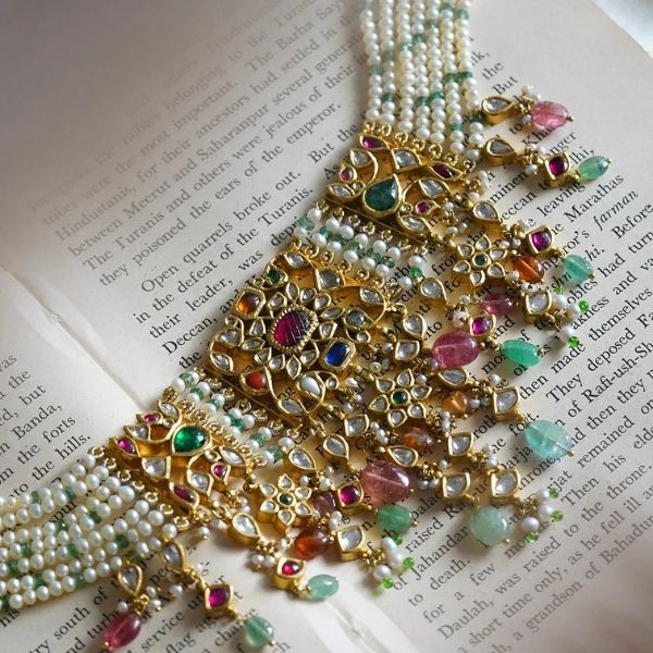 https://akm-img-a-in.tosshub.com/lingo/brt/images/photo_gallery/202507/aurus_amdavad_navya_navratna_necklace_regular_pricers._603855.jpg
