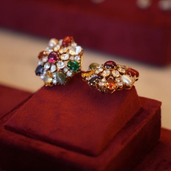 https://akm-img-a-in.tosshub.com/lingo/brt/images/photo_gallery/202507/proffini_navratna_bloom_studs_210000.00.jpg