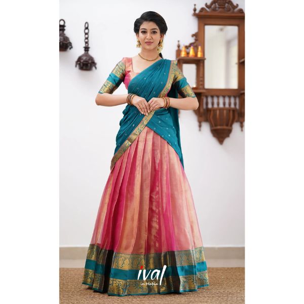 https://akm-img-a-in.tosshub.com/lingo/brt/images/photo_gallery/202508/ival_in_mabia_izhaiyini_-_peachish_pink_tone_and_shade_of_teal_blue_organza_halfsaree_5750.jpg