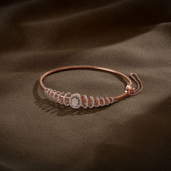 Tanishq Luxe Curves Diamond Bangle, ₹194,221 https://akm-img-a-in.tosshub.com/lingo/brt/images/photo_gallery/202508/tanishq_luxe_curves_diamond_banglers1_94_221.jpg