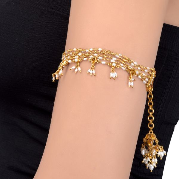 https://akm-img-a-in.tosshub.com/lingo/brt/images/photo_gallery/202508/tribe_amrapali_silver_gold_plated_lotus_citrine_pearl_drop_armlet_rs18025.00.jpg