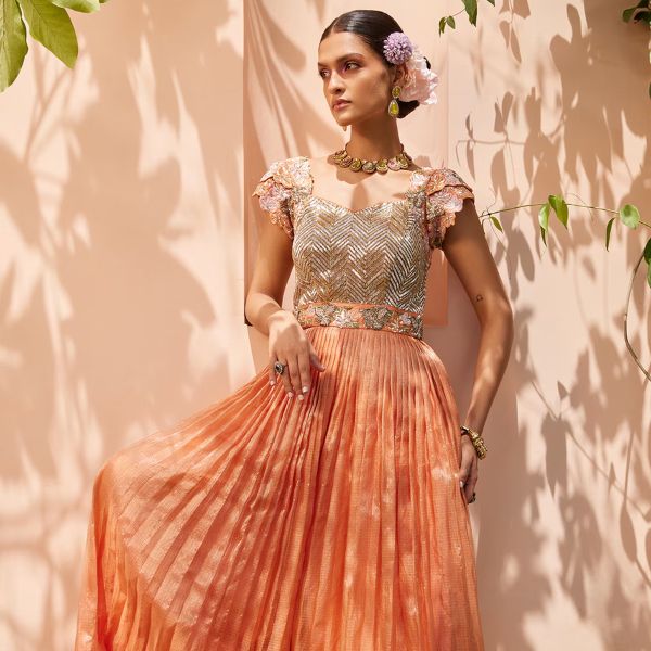 https://akm-img-a-in.tosshub.com/lingo/brt/images/photo_gallery/202510/anu_pellakuru_orange_kota_doria_embroidery_sweetheart_neck_floral_jumpsuit_rs47170.jpg