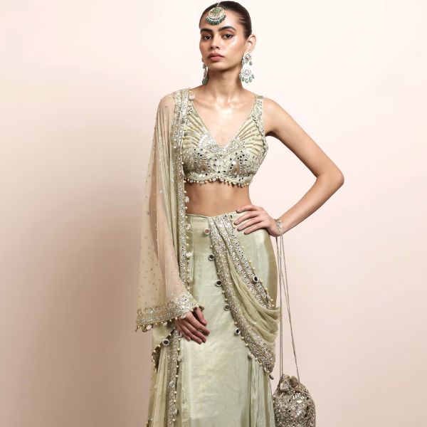 https://akm-img-a-in.tosshub.com/lingo/brt/images/photo_gallery/202510/arpita_mehta_green_net_tissue_pearls_sequins_mirrors_embroidered_hem_godet_saree_set_rs270000_2.jpg