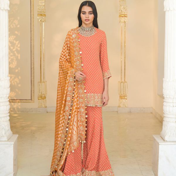 https://akm-img-a-in.tosshub.com/lingo/brt/images/photo_gallery/202510/arpita_mehta_warm_coral_hand_embroidered_short_kurta_sharara_set_price_on_request.jpg