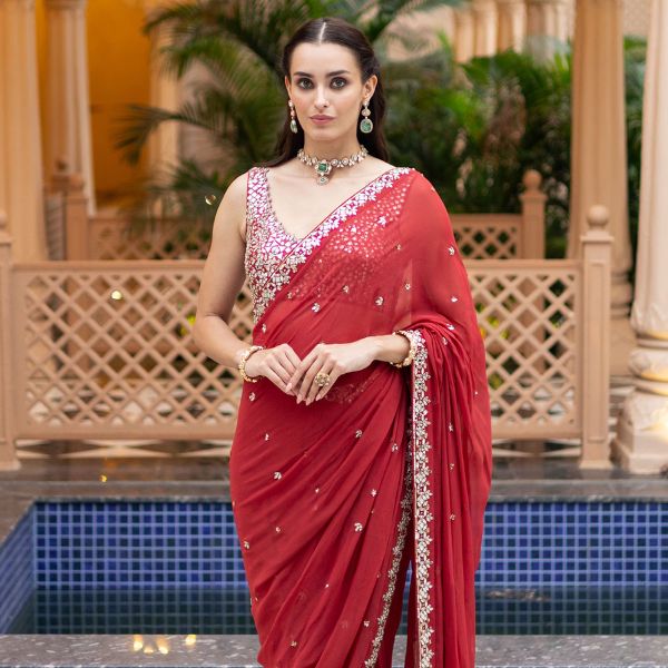 https://akm-img-a-in.tosshub.com/lingo/brt/images/photo_gallery/202510/esha_koul_red_chanderi_georgette_mirrors_round_embroidered_pre-draped_saree_rs34238.jpg