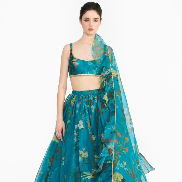 Gauri & Nainika Turquoise Chinoiserie Lehenga, ₹159,000 https://akm-img-a-in.tosshub.com/lingo/brt/images/photo_gallery/202510/gauri.png
