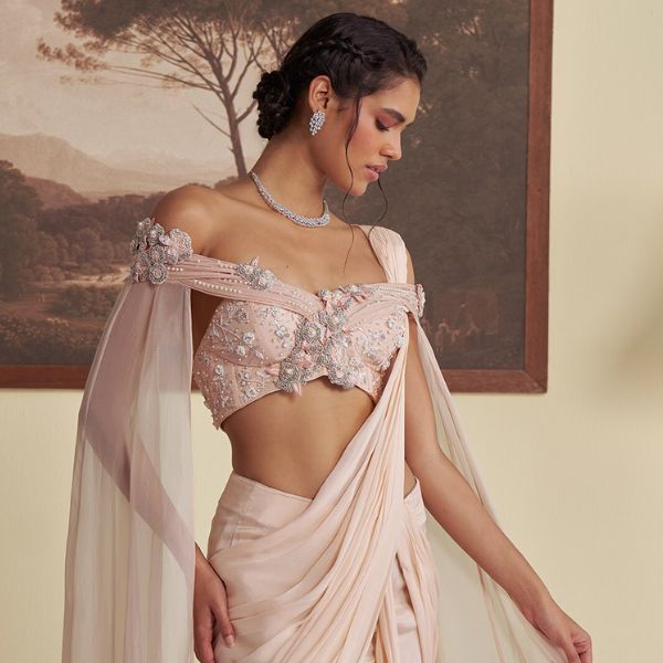 https://akm-img-a-in.tosshub.com/lingo/brt/images/photo_gallery/202510/jade_by_ashima_pink_organza_chiffon_chanderi_flora_pre-draped_saree_with_embroidered_blouse_rs47700_0.jpg