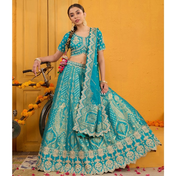 Koskii Turquoise Blue Zariwork Banarasi Lehenga, ₹20,990 https://akm-img-a-in.tosshub.com/lingo/brt/images/photo_gallery/202510/koskii.png