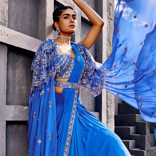 https://akm-img-a-in.tosshub.com/lingo/brt/images/photo_gallery/202510/miku_kumar_blue_georgette_embroidery_tassels_cape_and_pre-draped_lehenga_saree_set_rs101012_0.jpg