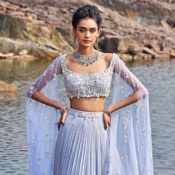 https://akm-img-a-in.tosshub.com/lingo/brt/images/photo_gallery/202510/nidhika_shekhar_blue_georgette_net_silk_sequins_suvarn_bela_maharani_blouse_and_lehenga_set_rs63600_0.jpg