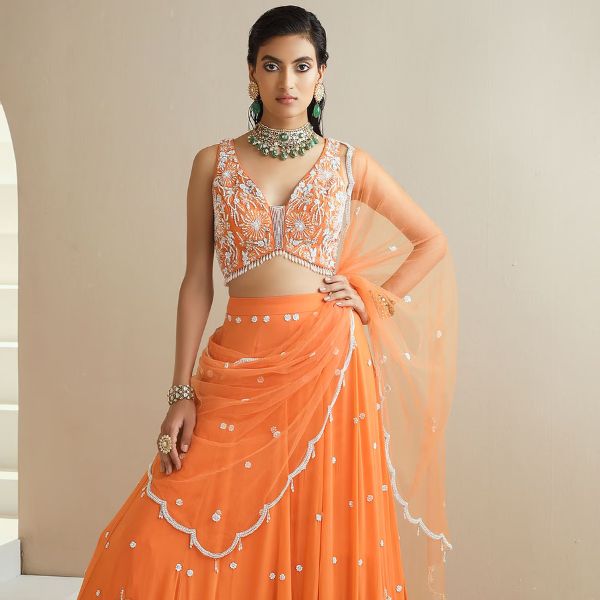 https://akm-img-a-in.tosshub.com/lingo/brt/images/photo_gallery/202510/seema_thukral_orange_choli_and_lehenga_georgette_dupatta_net_lining_satin_embellished_set_rs79800_0.jpg