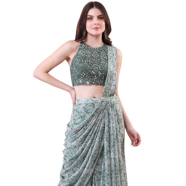 https://akm-img-a-in.tosshub.com/lingo/brt/images/photo_gallery/202512/isha_regalia_green_georgette_net_mirrors_embroidery_printed_pre-draped_saree_with_blouse_rs33000.jpg