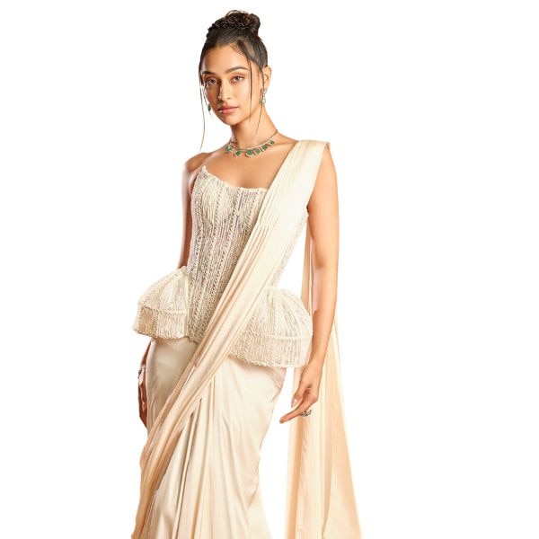https://akm-img-a-in.tosshub.com/lingo/brt/images/photo_gallery/202512/k_a_by_karishma_and_ashita_white_net_satin_beads_embroidery_square_neck_pre-draped_saree_and_corset_set_rs91000.jpg
