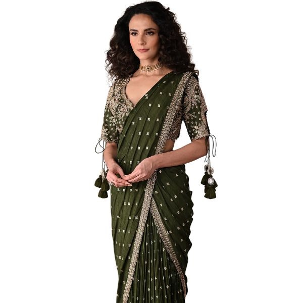https://akm-img-a-in.tosshub.com/lingo/brt/images/photo_gallery/202512/onaya_olive_green_chanderi_embroidery_sequins_zari_blouse_and_pre-draped_saree_set_rs37995.jpg