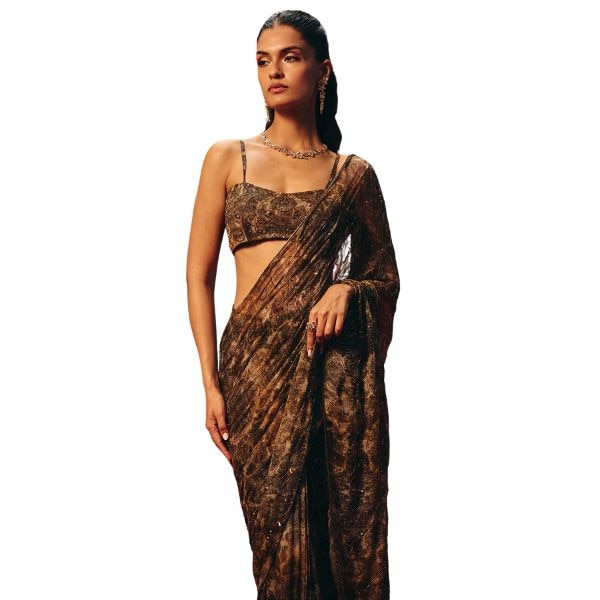 https://akm-img-a-in.tosshub.com/lingo/brt/images/photo_gallery/202512/roze_brown_chiffon_sequins_tassels_beads_aleesa_pre-draped_saree_and_blouse_set_rs39990.jpg