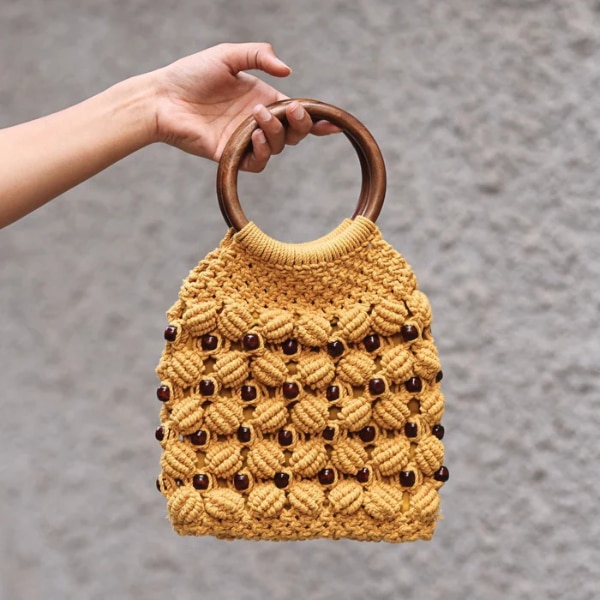https://akm-img-a-in.tosshub.com/lingo/brt/images/photo_gallery/202601/brown_living_handmade_macrame_ring_handbag_rs2499.png