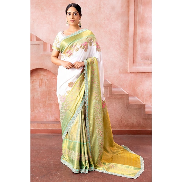 https://akm-img-a-in.tosshub.com/lingo/brt/images/photo_gallery/202601/neeta_lulla_white_olive_green_kanjivaram_silk_embroidered_saree_set_rs175000.png