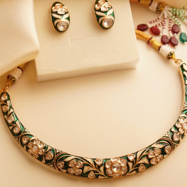 https://akm-img-a-in.tosshub.com/lingo/brt/images/photo_gallery/202602/mrjewels_meenakari_hasli_choker_necklace_set_with_studs_rs10000_0.png