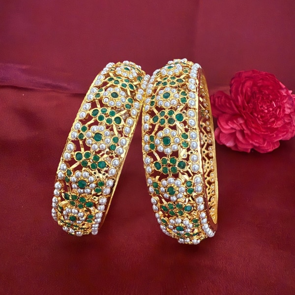 https://akm-img-a-in.tosshub.com/lingo/brt/images/photo_gallery/202602/rebaari_flower_design_jadau_bangles_rs4150.png