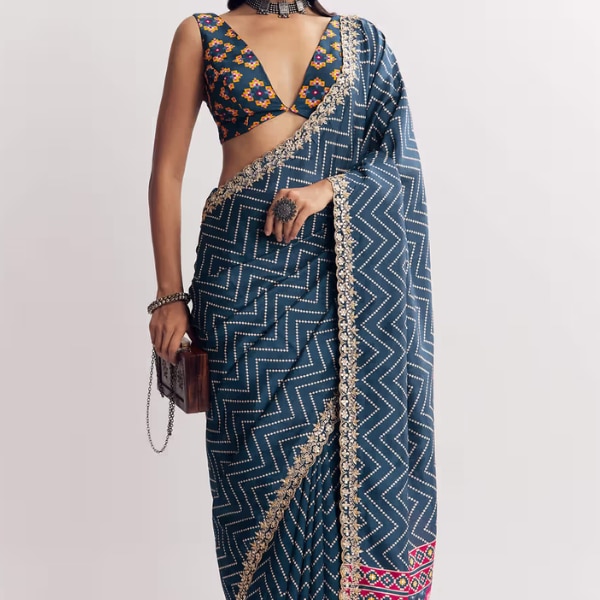 https://akm-img-a-in.tosshub.com/lingo/brt/images/photo_gallery/202603/kalki_navy_blue_muslin_ajrakh_printed_saree_with_gota_and_mirror_work_rs9995.png