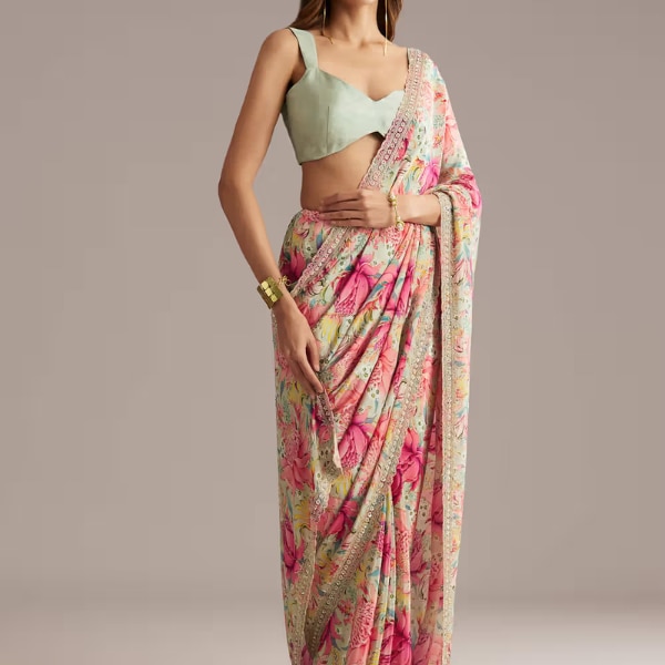 https://akm-img-a-in.tosshub.com/lingo/brt/images/photo_gallery/202603/kalki_pista_green_crepe_saree_with_floral_print_and_sequin_work_rs14995.png
