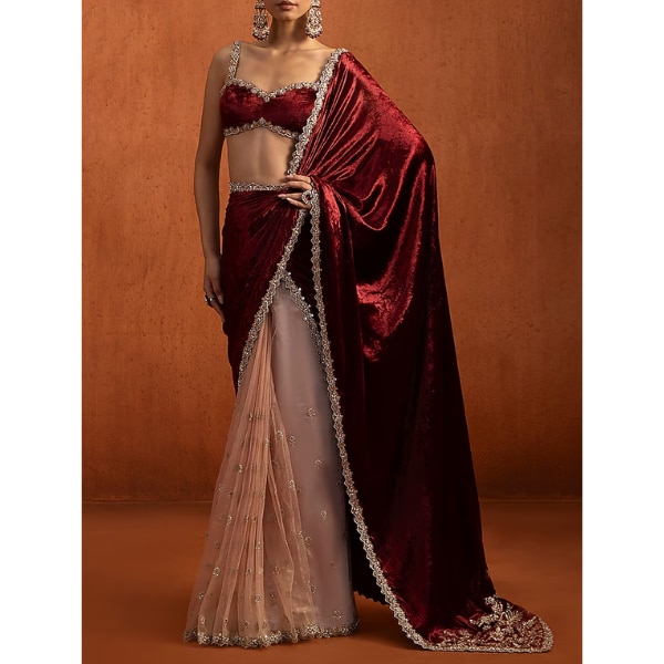 https://akm-img-a-in.tosshub.com/lingo/brt/images/photo_gallery/202603/lashkaraa_red_viscose_velvet_sequins_embroidered_saree_set_rs15900.png