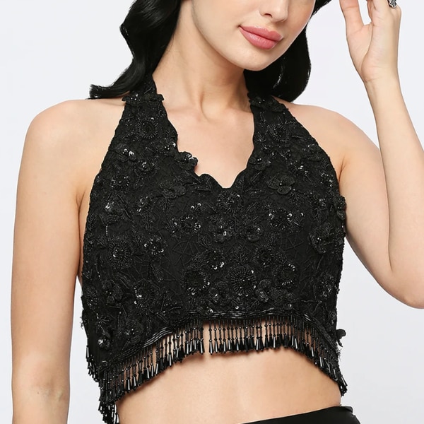 https://akm-img-a-in.tosshub.com/lingo/brt/images/photo_gallery/202603/neha_mehra_black_halter_neck_blouse_rs19000.png