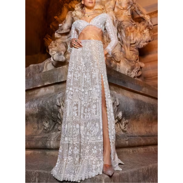 https://akm-img-a-in.tosshub.com/lingo/brt/images/photo_gallery/202603/seema_gujral_plunge_neck_embroidered_slit_skirt_and_blouse_set_rs188000_0.png