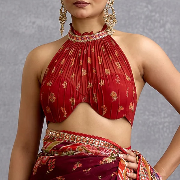 https://akm-img-a-in.tosshub.com/lingo/brt/images/photo_gallery/202603/torani_maroon_georgette_printed_halter-neck_blouse_rs20500.png