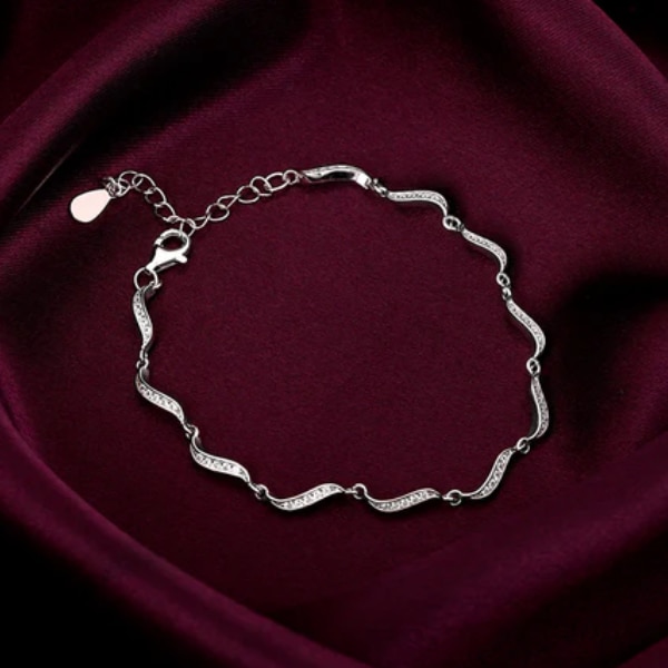 https://akm-img-a-in.tosshub.com/lingo/brt/images/photo_gallery/202604/giva_silver_graceful_waves_bracelet_rs7299.png